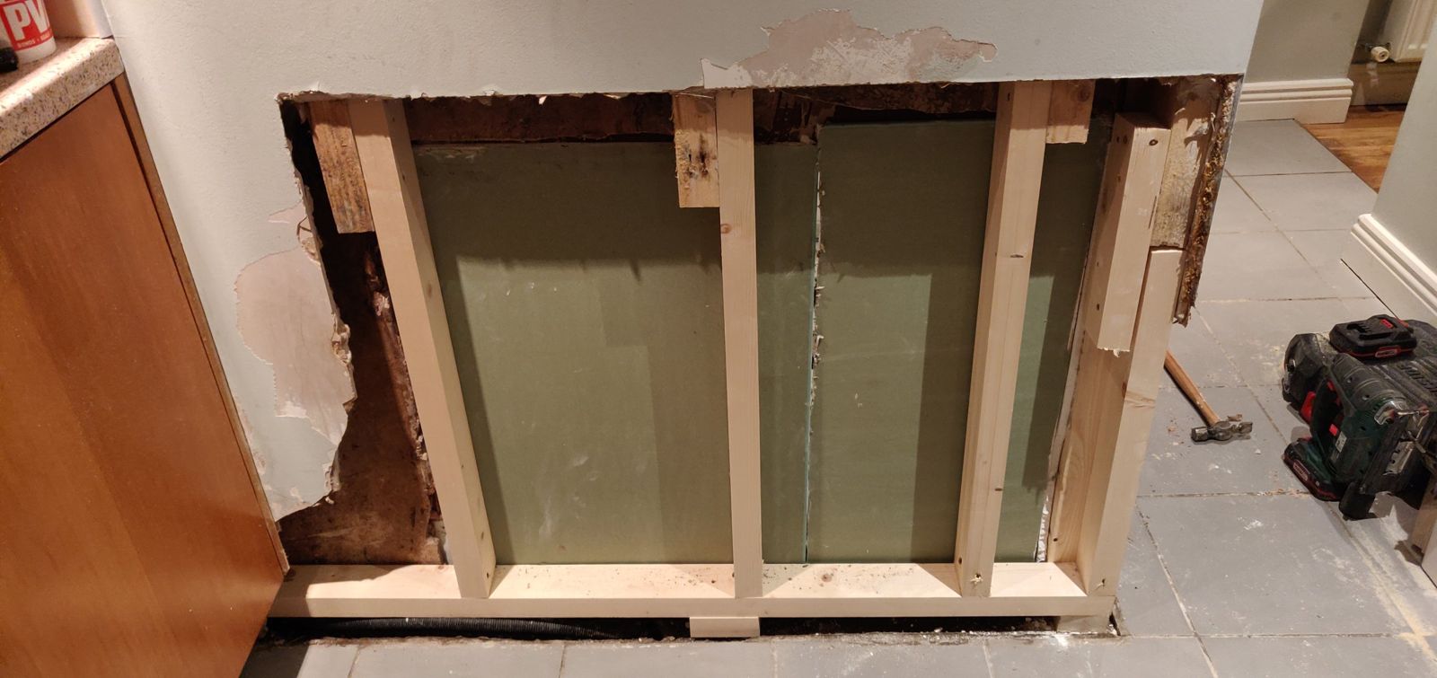 New timber frame and moisture-resistant board fitted