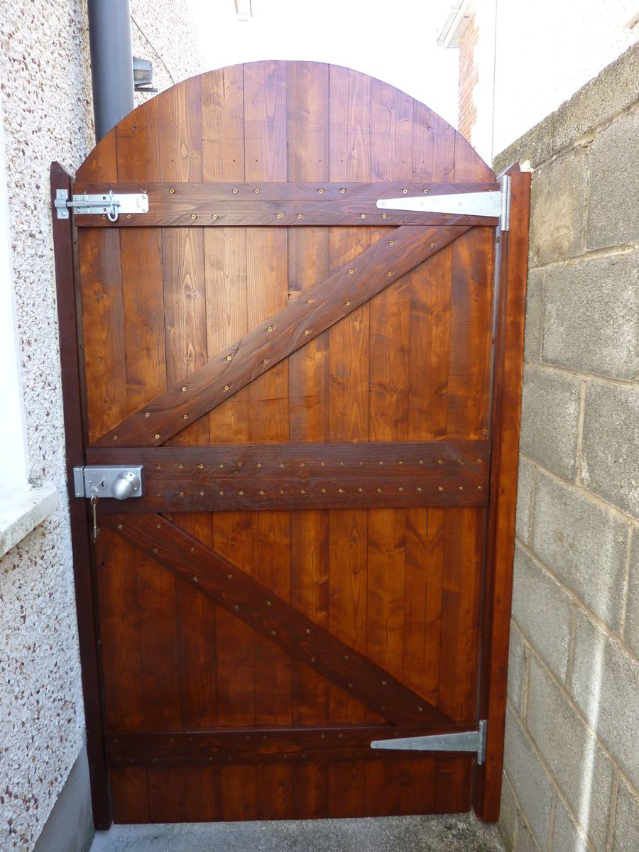 New arched stained timber side gate with lock and bolt