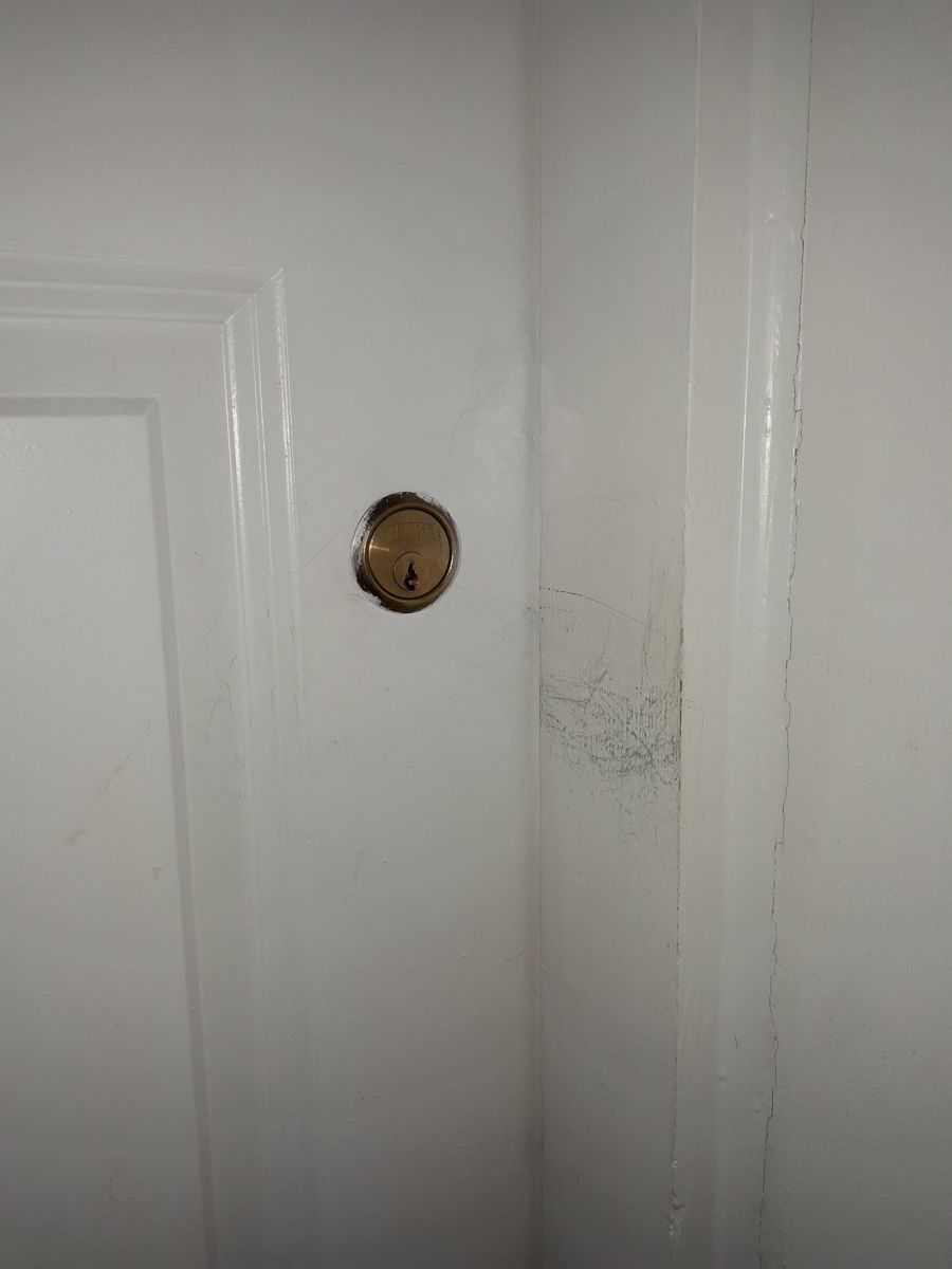 Same door repaired and repainted, repair invisible