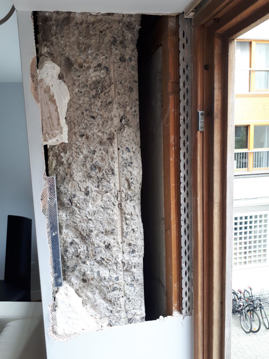 Loose plaster removed back to the concrete