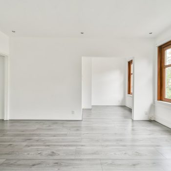 The interior of a white room with windows